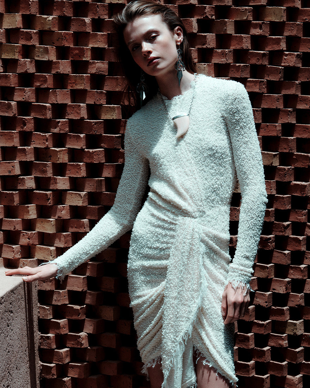 Feminine model, dressed in the Ophelie draped dress in ecru bouclé jersey