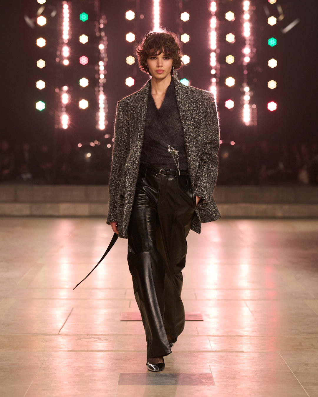 FW25 look 17 walking with grey wool coat, leather black pants.