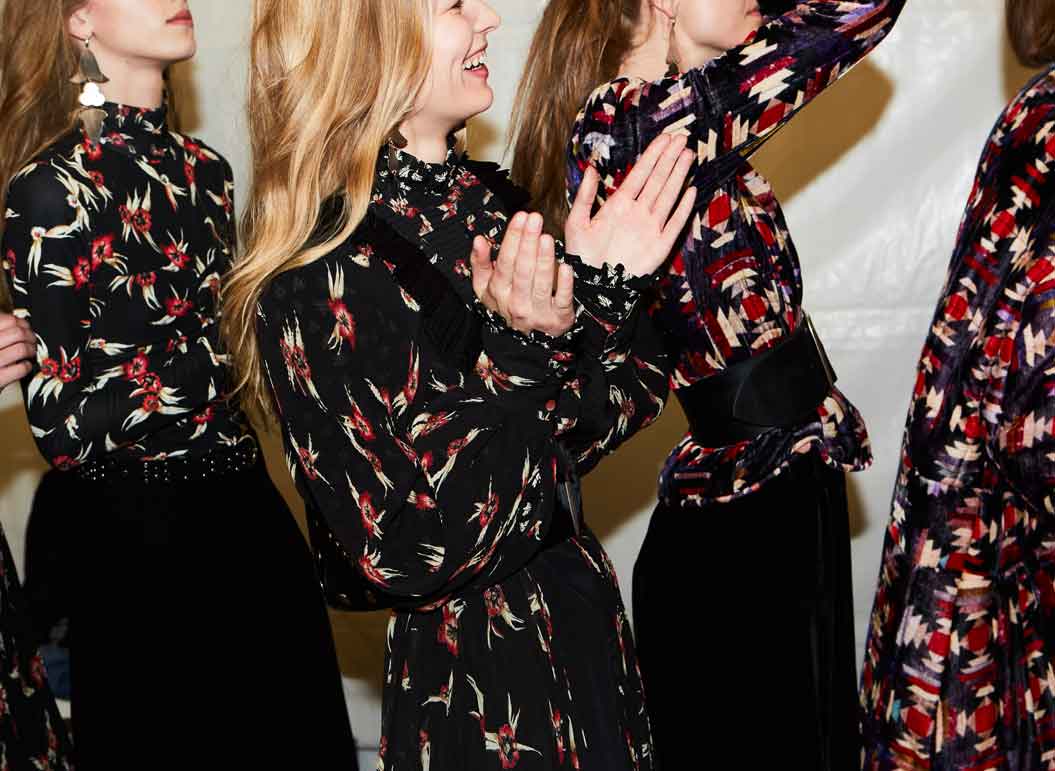 Model in backstage of an old show cheering up