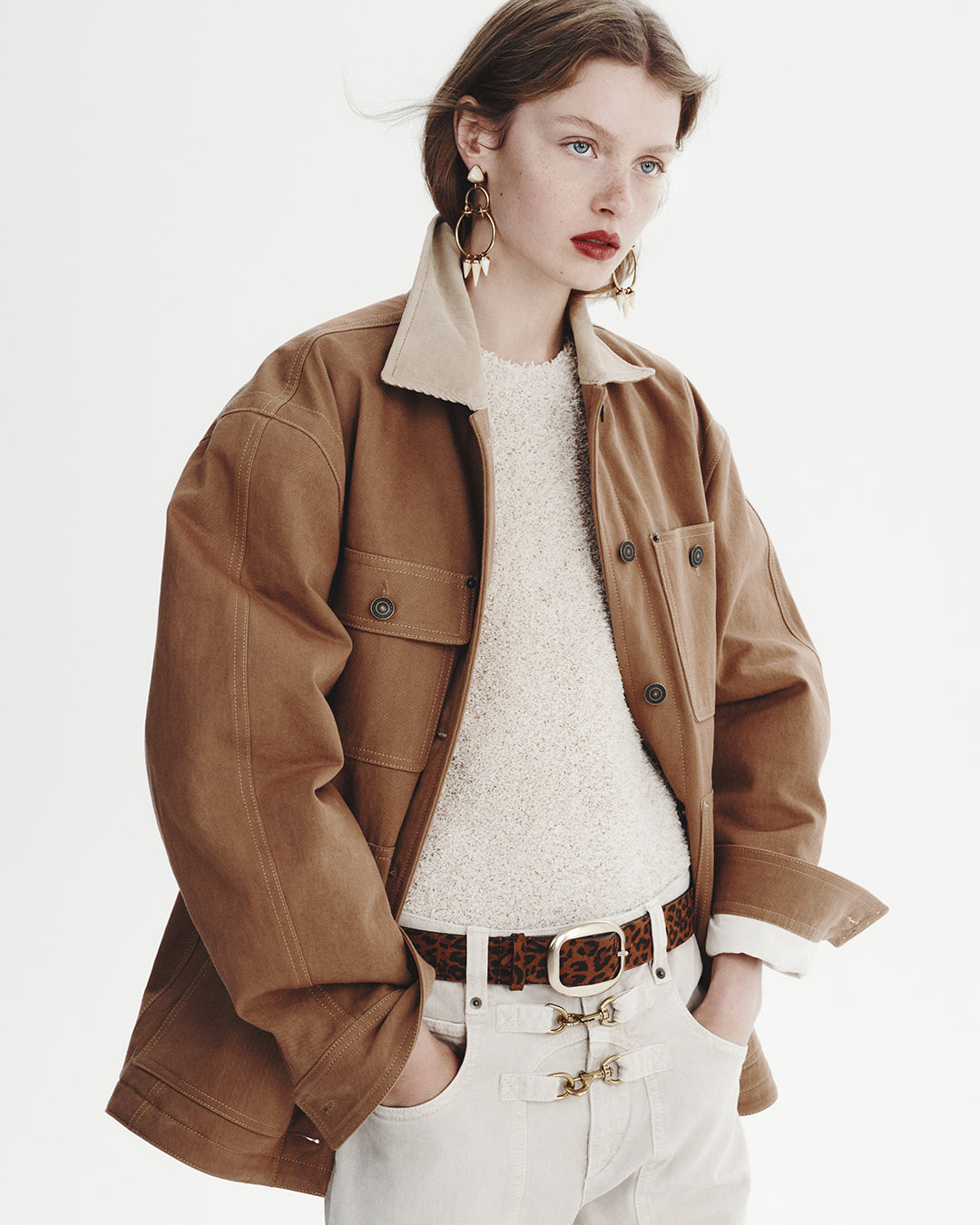 The model is wearing the Ninon cotton workwear jacket and the high-waisted Brinley denim pants.