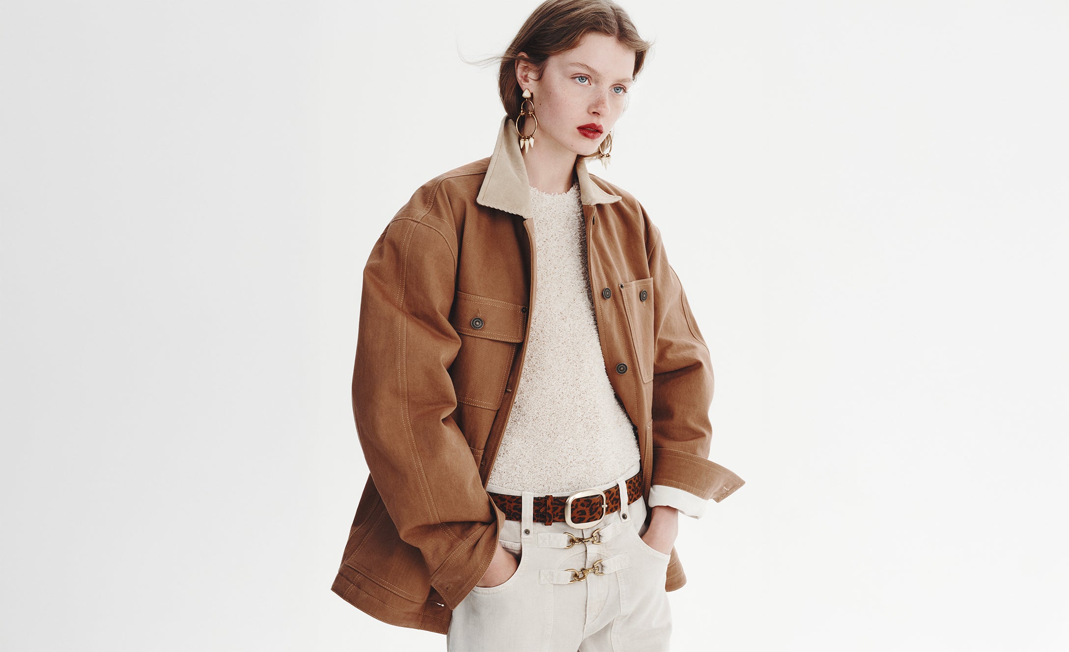 The model is wearing the Ninon cotton workwear jacket and the high-waisted Brinley denim pants.